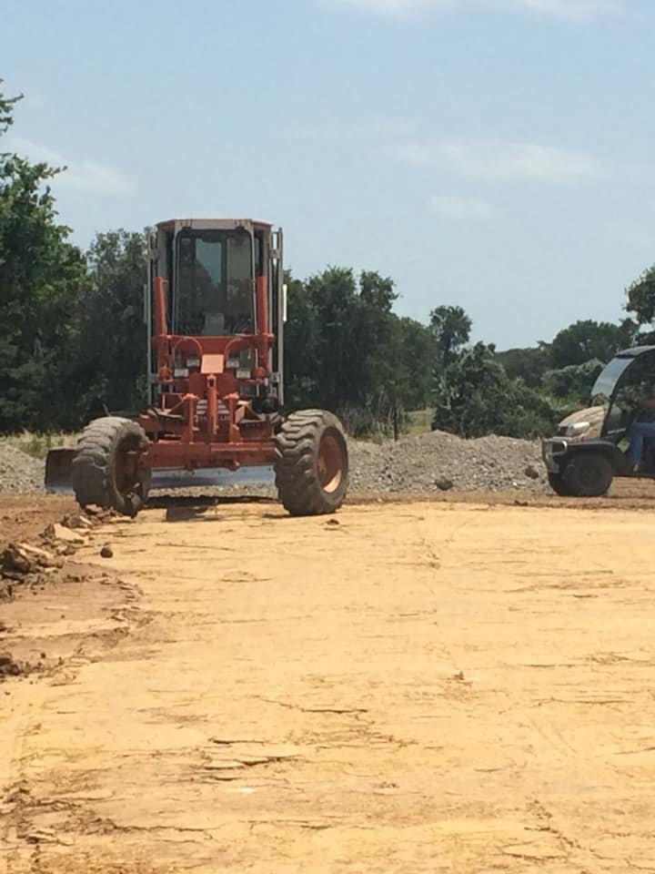 Maintainer grading for site preparation ~ David Neal Trucking